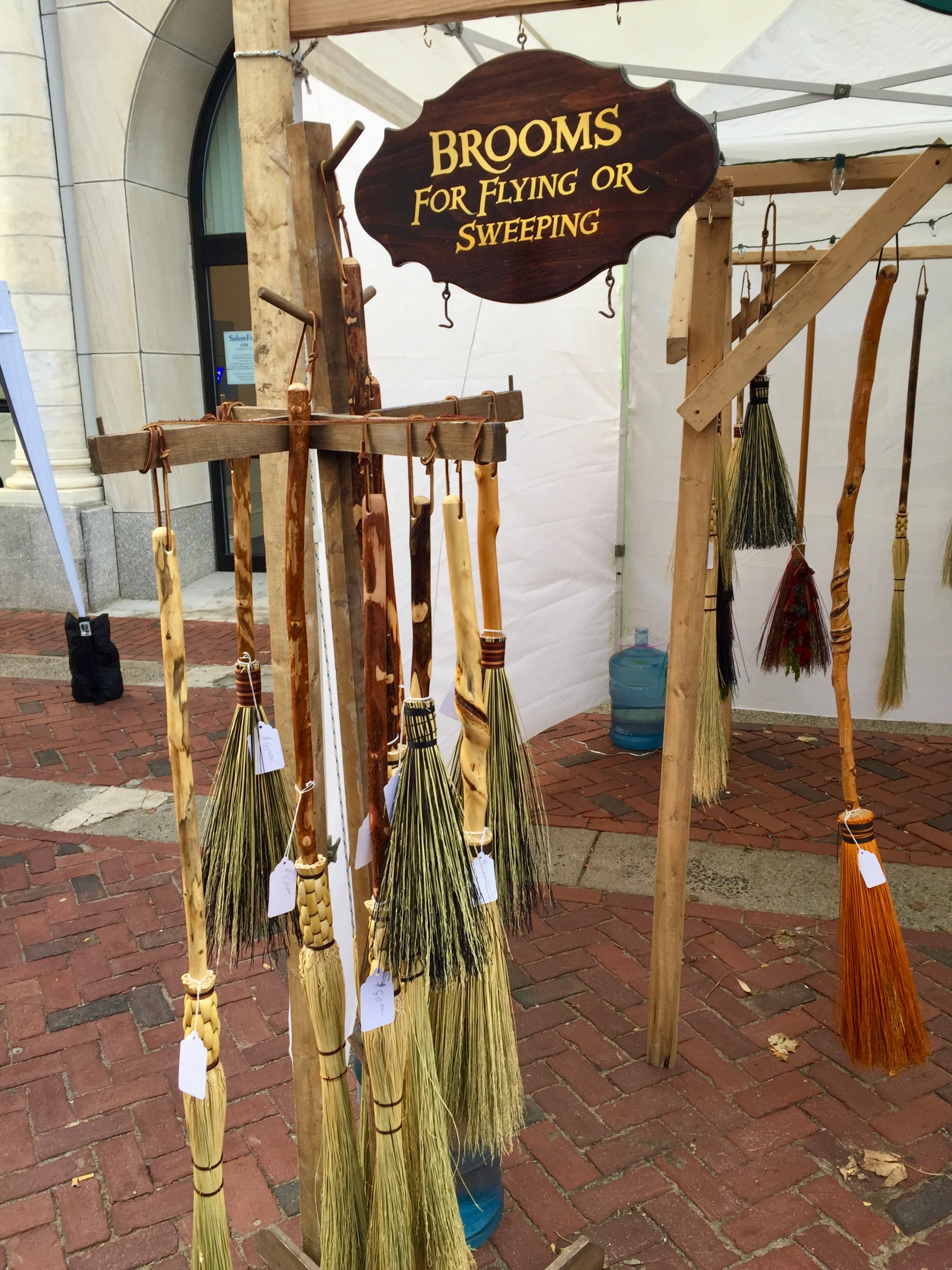A storefront selling witches brooms in Salem, MA
