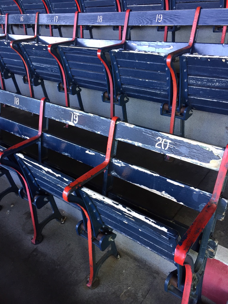 A set of historic blue seats at Fenway Park during our tour